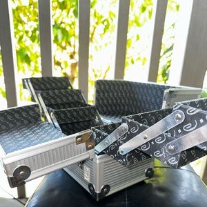 Caboodle silver make up box.